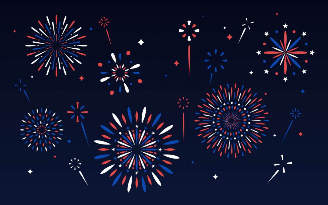 Multiple red, white and blue fireworks against a dark blue background.