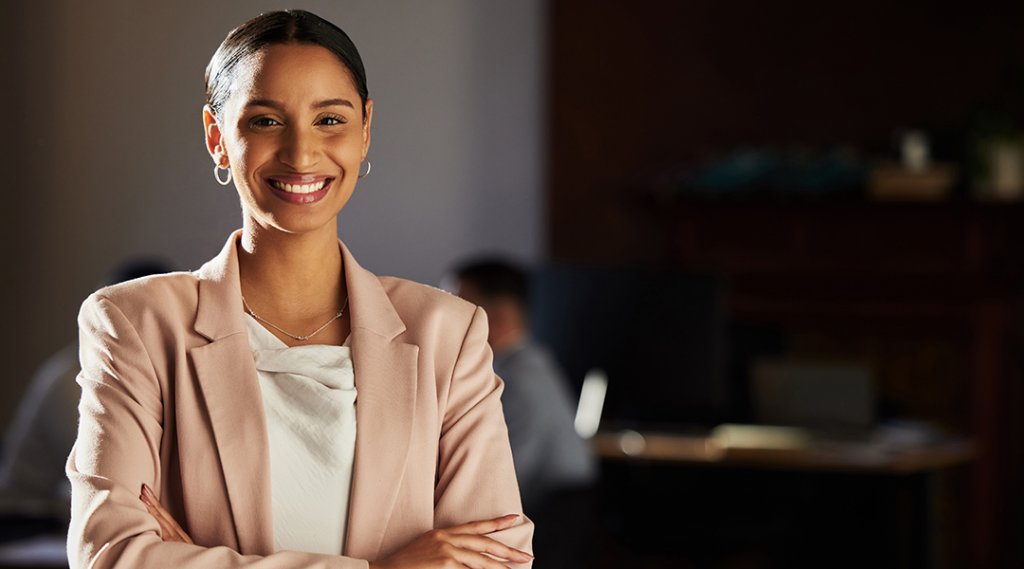 Portrait of a lawyer at a law firm feeling proud of their work.