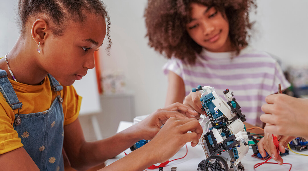 A group of students in STEM class making robots.