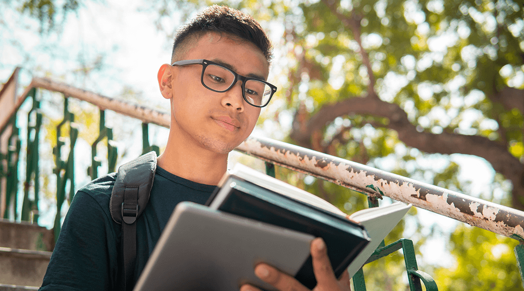 https://www.carnegielibrary.org/wp-content/uploads/2024/07/Teen_Boy_Reading_1080x600-300x167.png