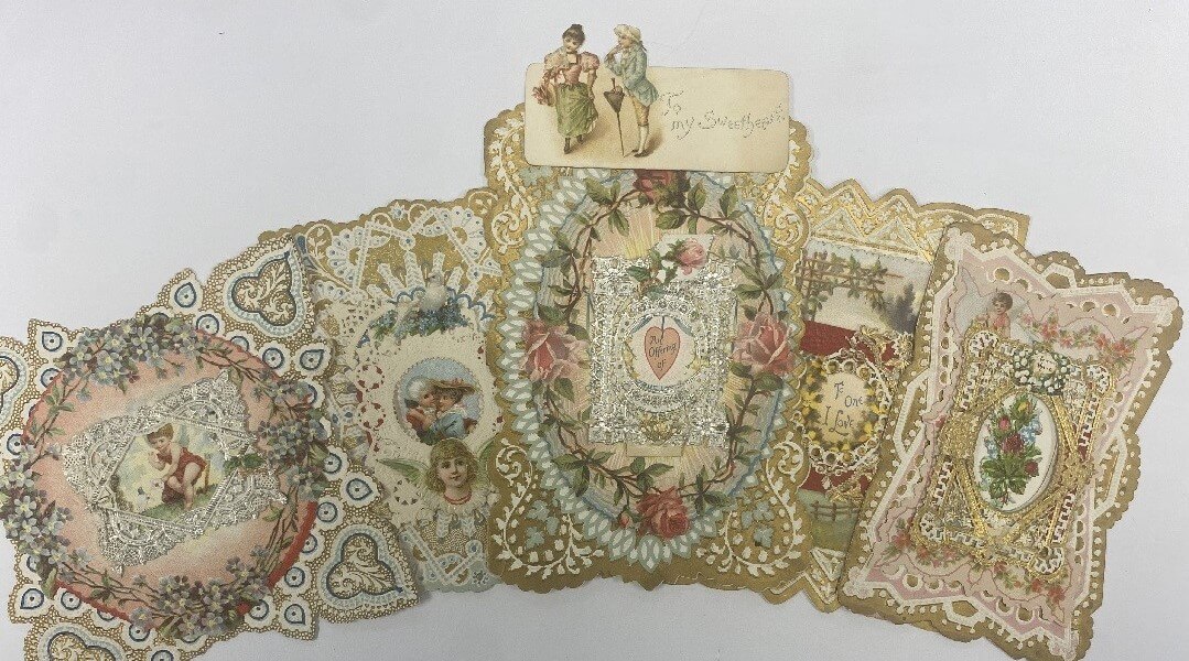 A Victorian Era die-cut Valentine's card adorned with paper lace and florals