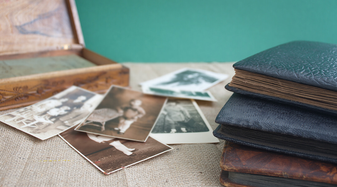 Retro photo album with vintage photographs in sepia color