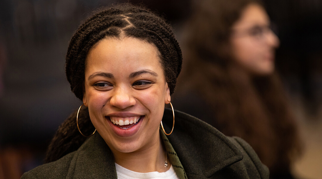 Close-up of a smiling teenager at a library event.